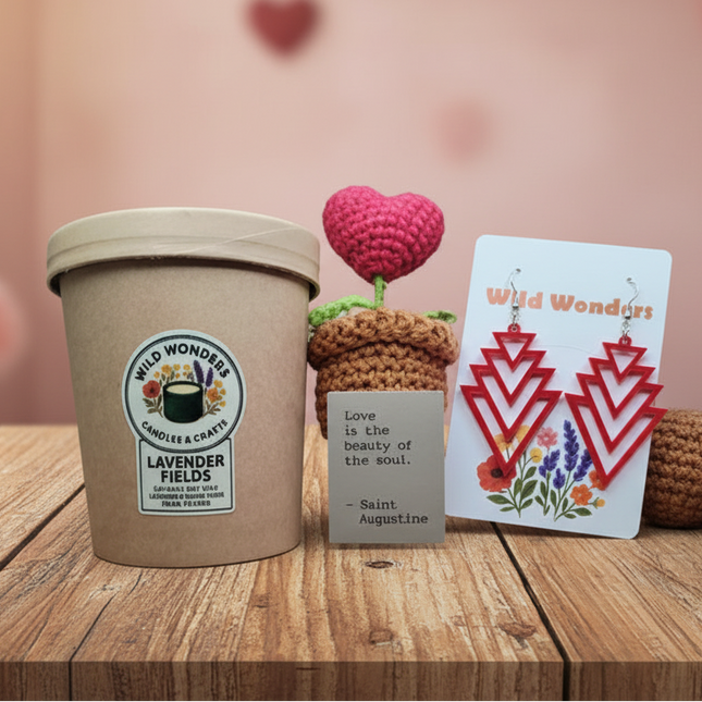 Cup of lavender ice cream with a card and small crocheted plants on a wooden surface.